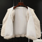 Faux-fur gilet with bold oversized lapel, styled over a knit, front view