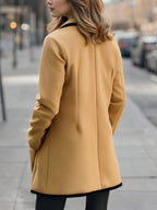 Relaxed double-breasted coat with contrast trim, three-quarter view