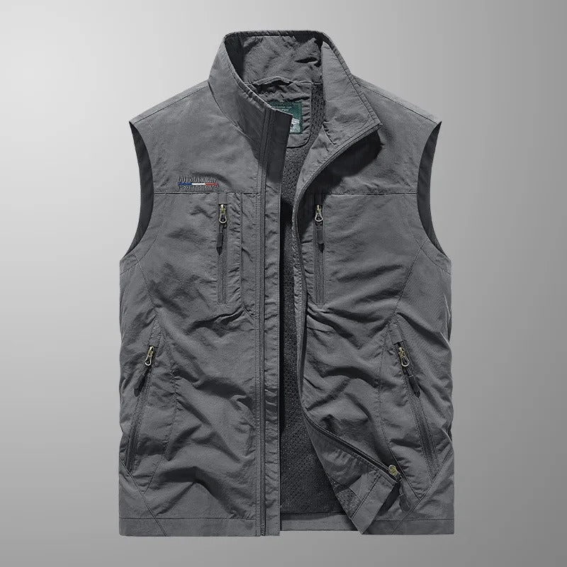 Bodywarmer vest layered over a shirt outdoors