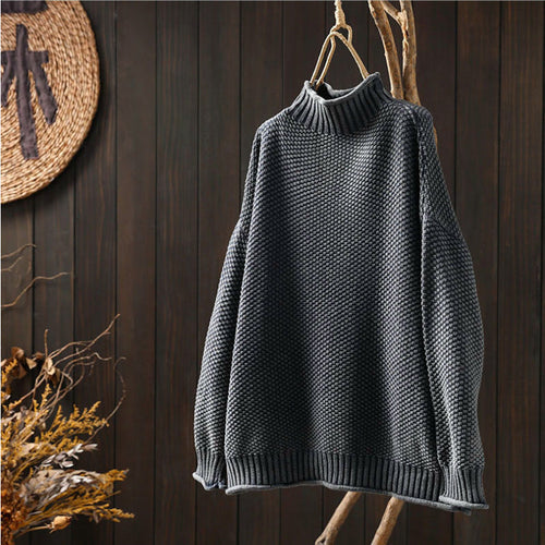 Classic turtleneck knit sweater.