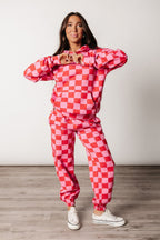 Pink and red checkered hoodie, three-quarter styled view