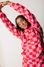 Pink and red checkered hoodie, back view