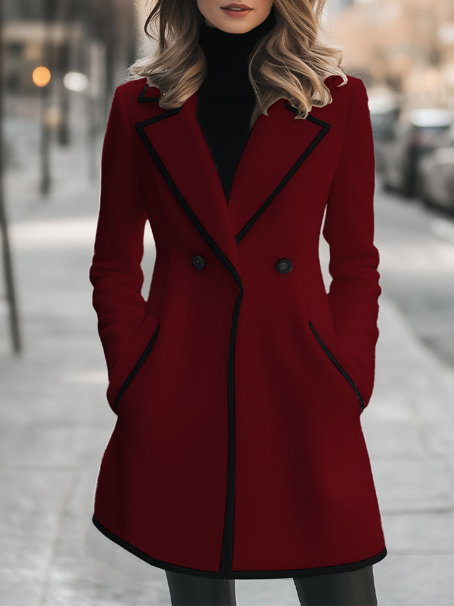 Double-breasted coat with contrast trim along the edges, front view