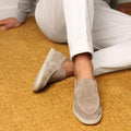 Suede yacht loafers in beige, slip-on style with stitched detailing, side view.
