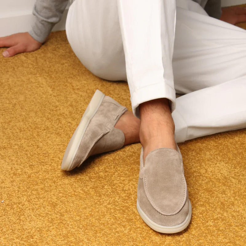 Suede yacht loafers in beige, slip-on style with stitched detailing, side view.