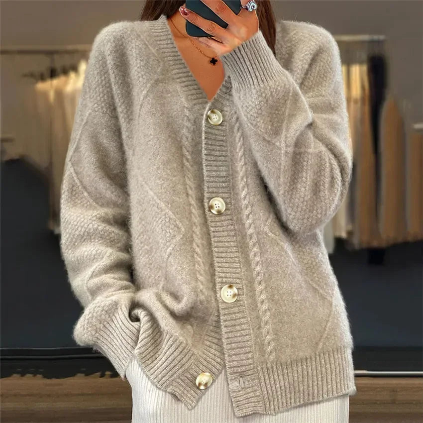 Soft knit cardigan shown from the side with a hip-length fitted silhouette