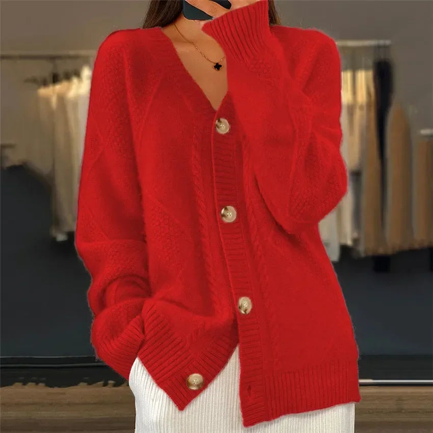 Soft knit cardigan detail showing the neckline and long sleeve cuff