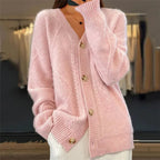 Soft knit cardigan detail showing the button front and knitted texture