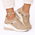 Orthopedic shoes with wedge sole in beige, breathable lace-up upper, side view.