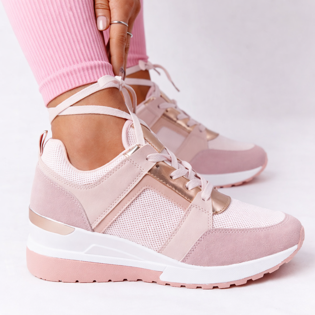 Orthopedic shoes with wedge sole in pink, breathable lace-up upper, side view.