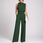 Sleeveless jumpsuit in green with high neckline and wide-leg trousers, full-length view.