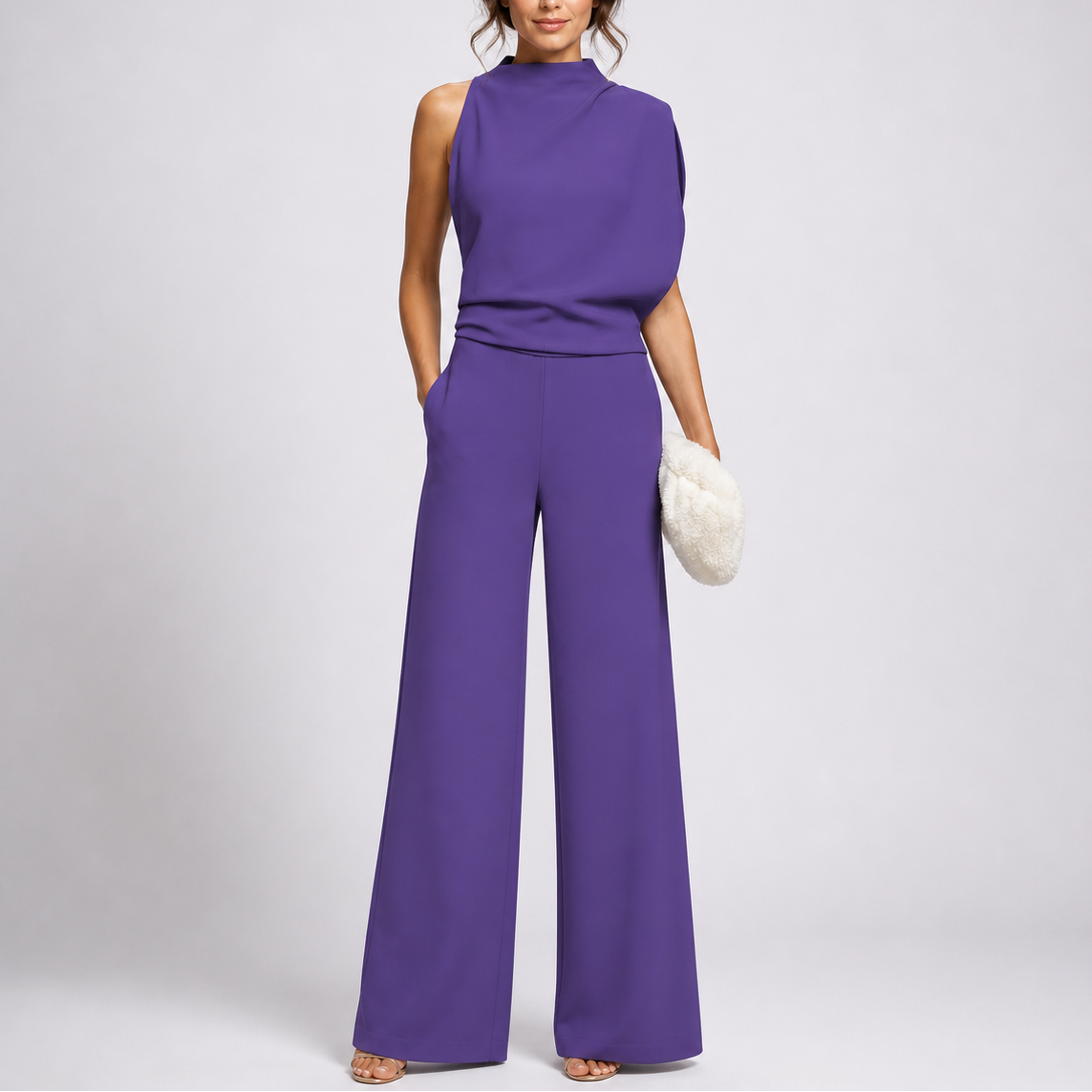 Sleeveless jumpsuit in purple with high neckline and wide-leg trousers, full-length view.