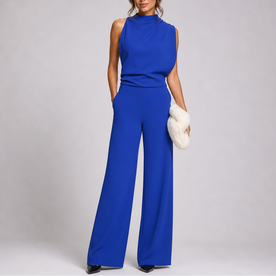 Sleeveless jumpsuit in blue with high neckline and wide-leg trousers, full-length view.