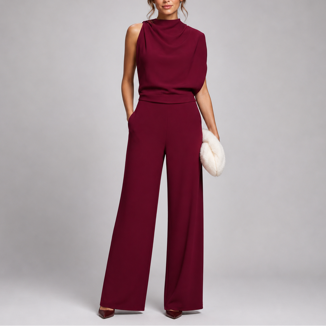 Sleeveless jumpsuit in red with high neckline and wide-leg trousers, full-length view.