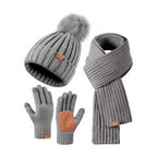 Knitted pompom hat from the winter hat, scarf and gloves set
