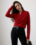 Crossover-collar knit sweater in pink.