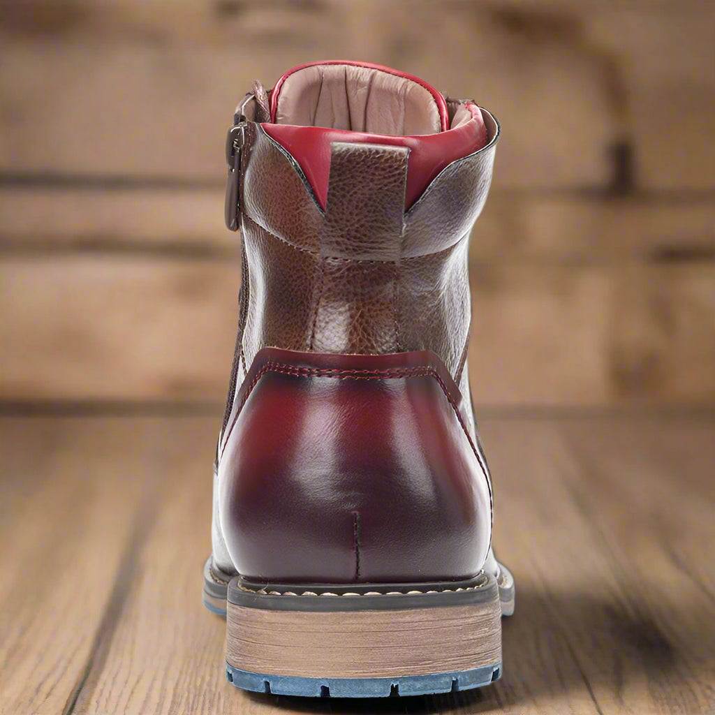 Close-up of the side zip and lacing on the brown round-toe boots