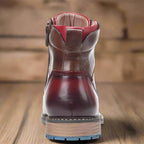 Close-up of the side zip and lacing on the brown round-toe boots