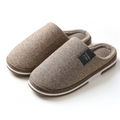 Brown slippers with soft lining and sturdy sole, pair shown front view