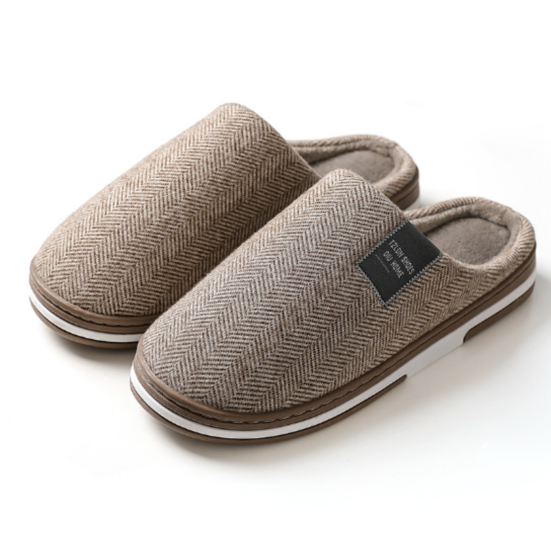 Brown slippers with soft lining and sturdy sole, pair shown front view