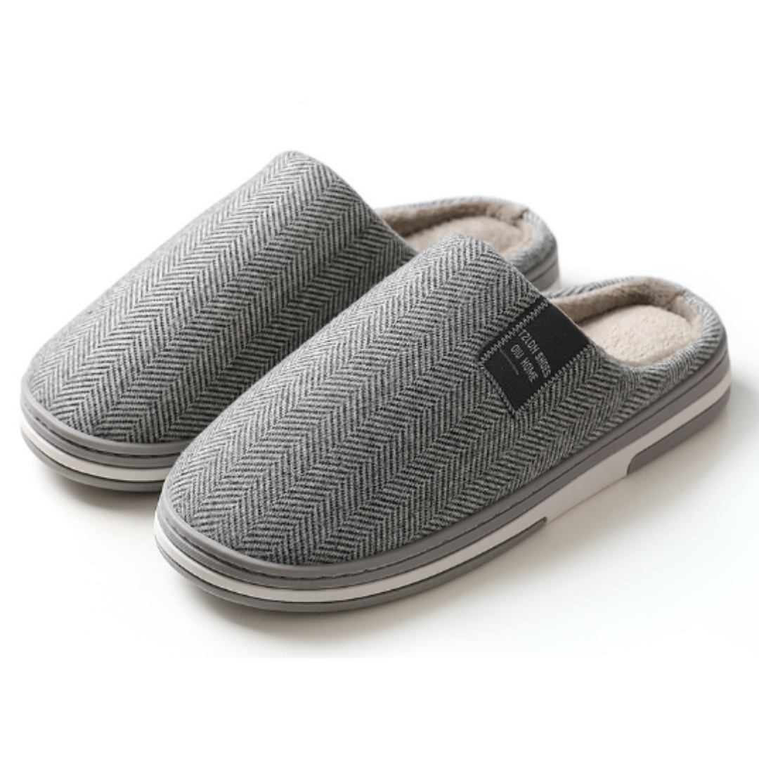 Light grey slippers with soft warm lining and sturdy sole, pair front view