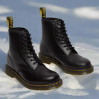 Lace up boots with front lacing system, side view