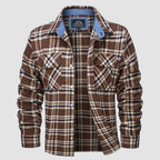 Plaid flannel shirt detail: button-down front, chest pockets and double-button cuffs.