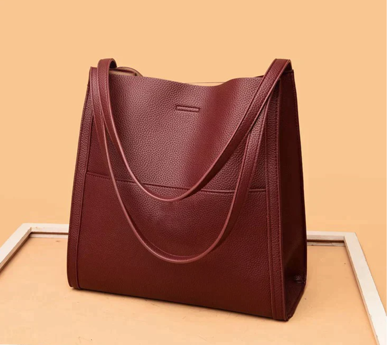 Leather-look shoulder bag structured silhouette side view
