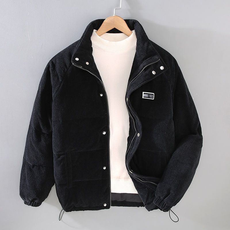 Black padded corduroy jacket with full-zip front and deep pockets, warm winter outerwear