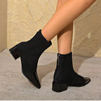 Suede-look ankle boots with block heel styled with tailored trousers