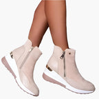 Beige orthopedic ankle boots with wedge sole and side zip, side view