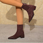 Suede-look ankle boots with block heel shown at an angle