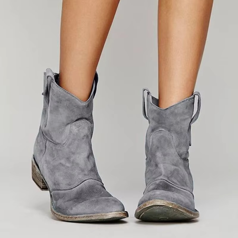 Western ankle boots in gray with pointed toe and low block heel, side view.