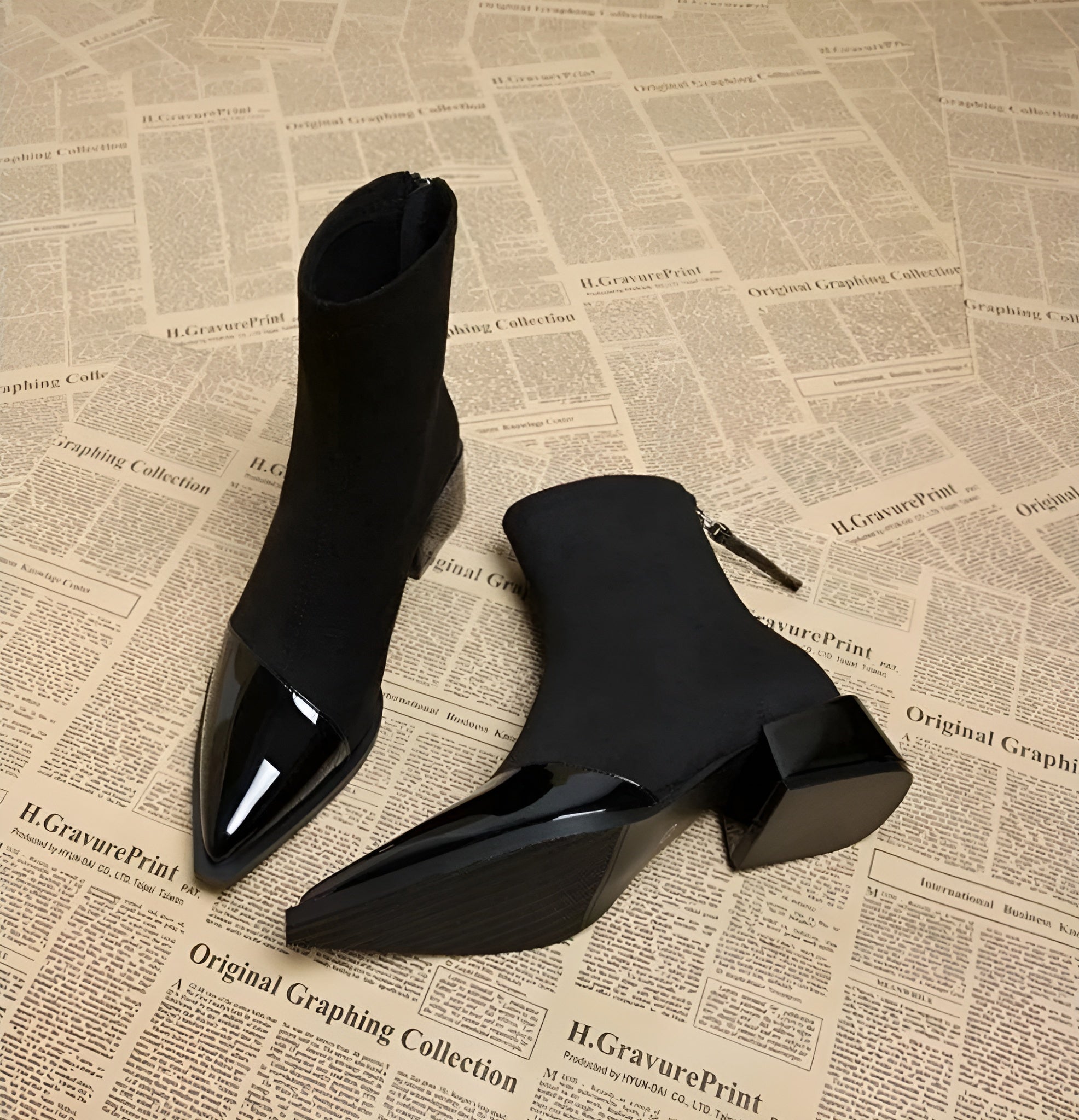 Suede-look ankle boots detail showing the side zip entry