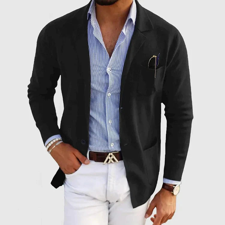 Black tailored blazer with classic lapel and patch pockets, front view