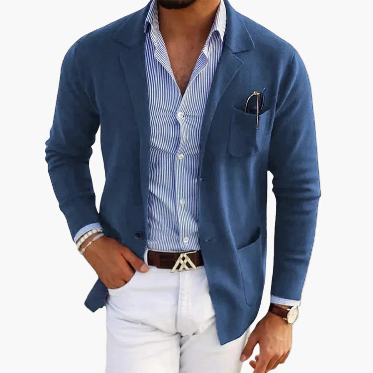 Blue tailored blazer with classic lapel and patch pockets, worn open over a shirt