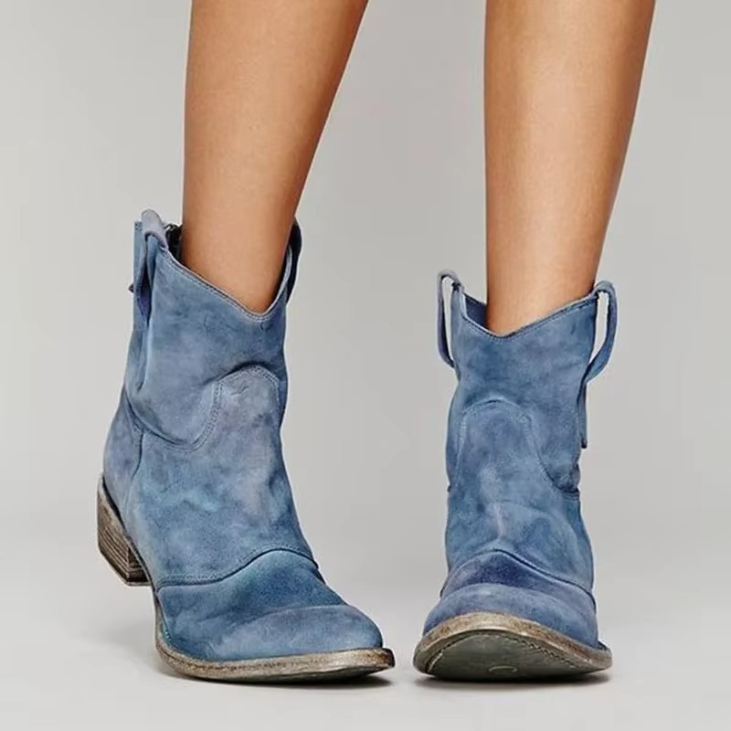 Western ankle boots in blue with pointed toe and low block heel, side view.