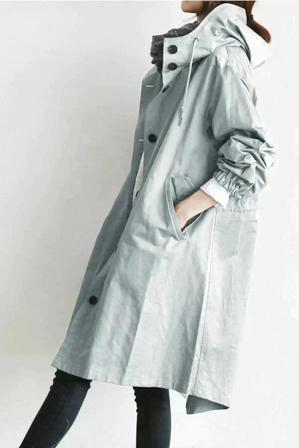 Rain coat in navy with an oversized hood, waterproof outer fabric, front view.