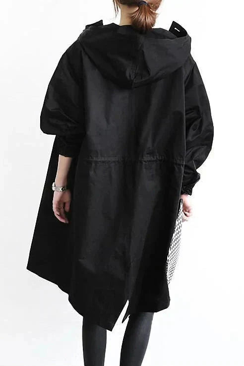 Rain coat in red with an oversized hood and waterproof finish, front view.