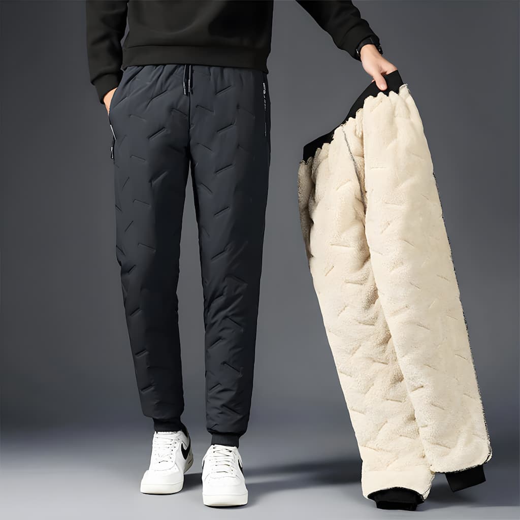 Thermal fleece-lined jogger pants in black with zip pockets, front view