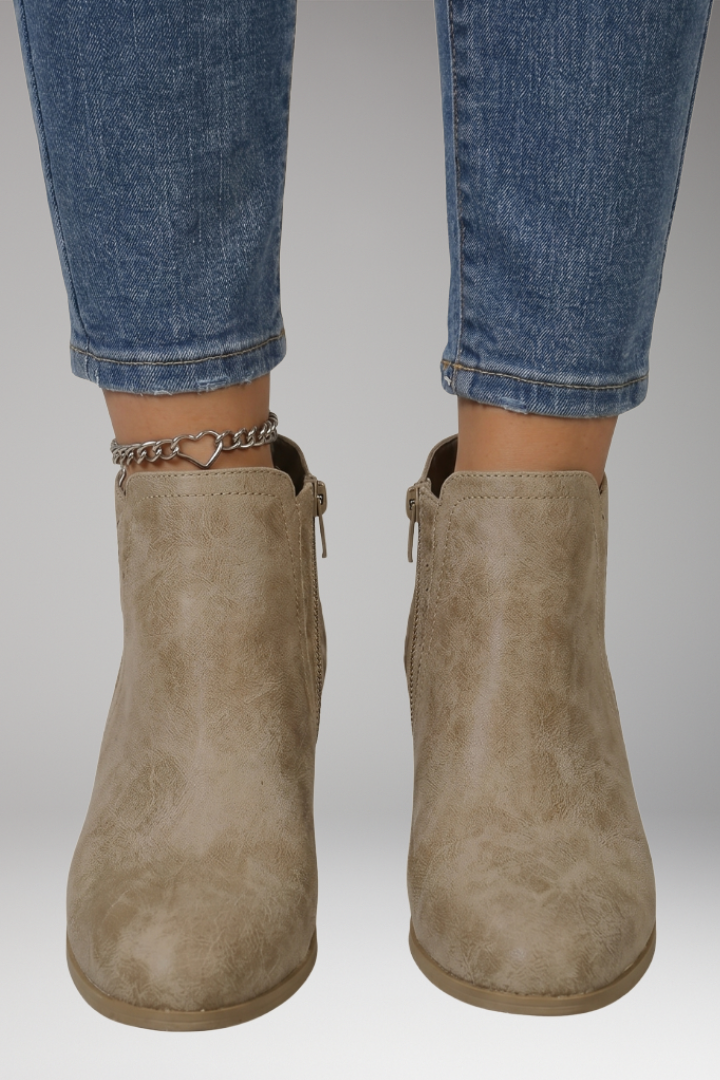 Close-up of laser-cut detailing on breathable comfort boots