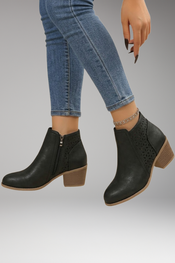 Black laser-cut comfort boots with breathable upper, side view