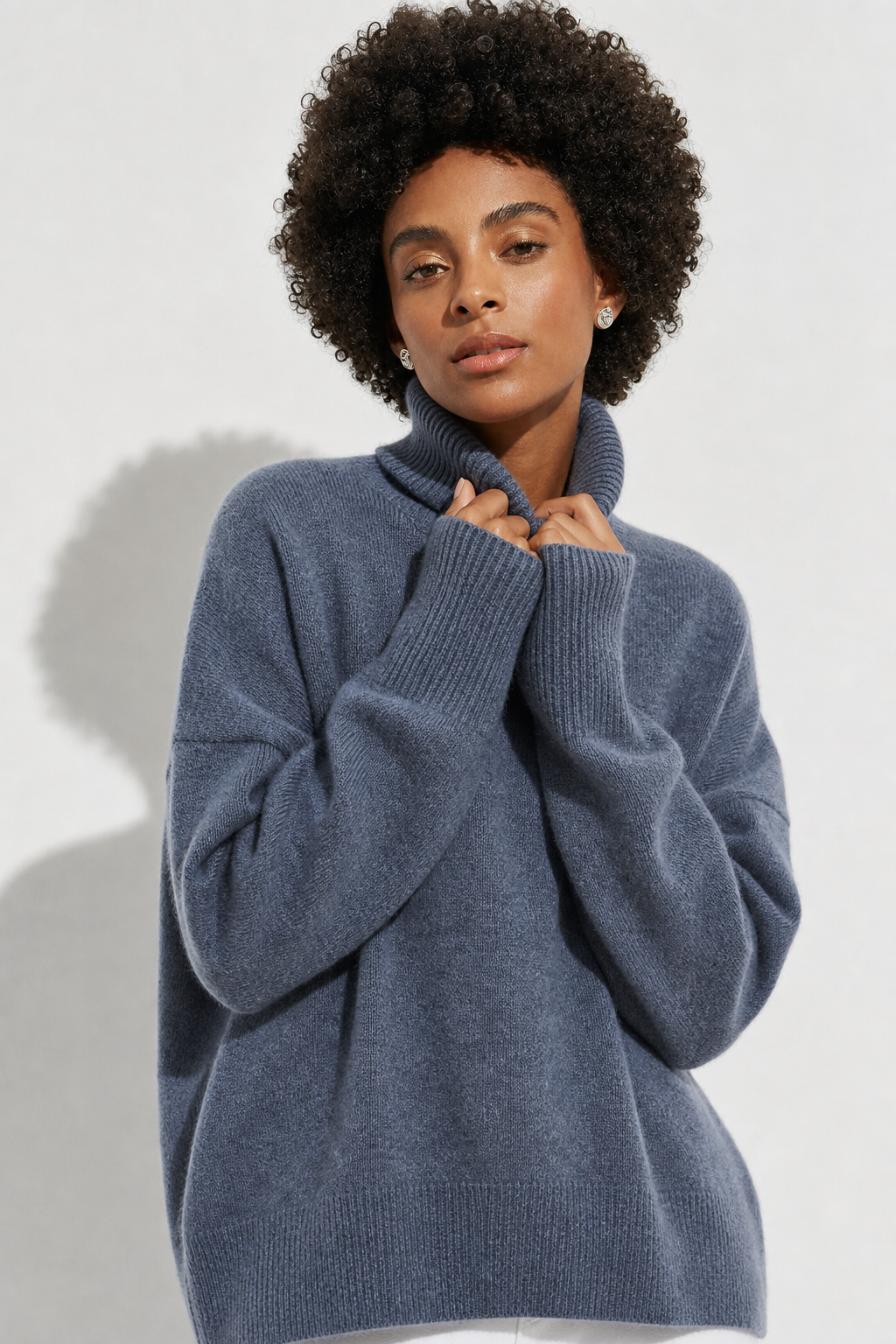 Oversized merino-blend turtleneck in blue.