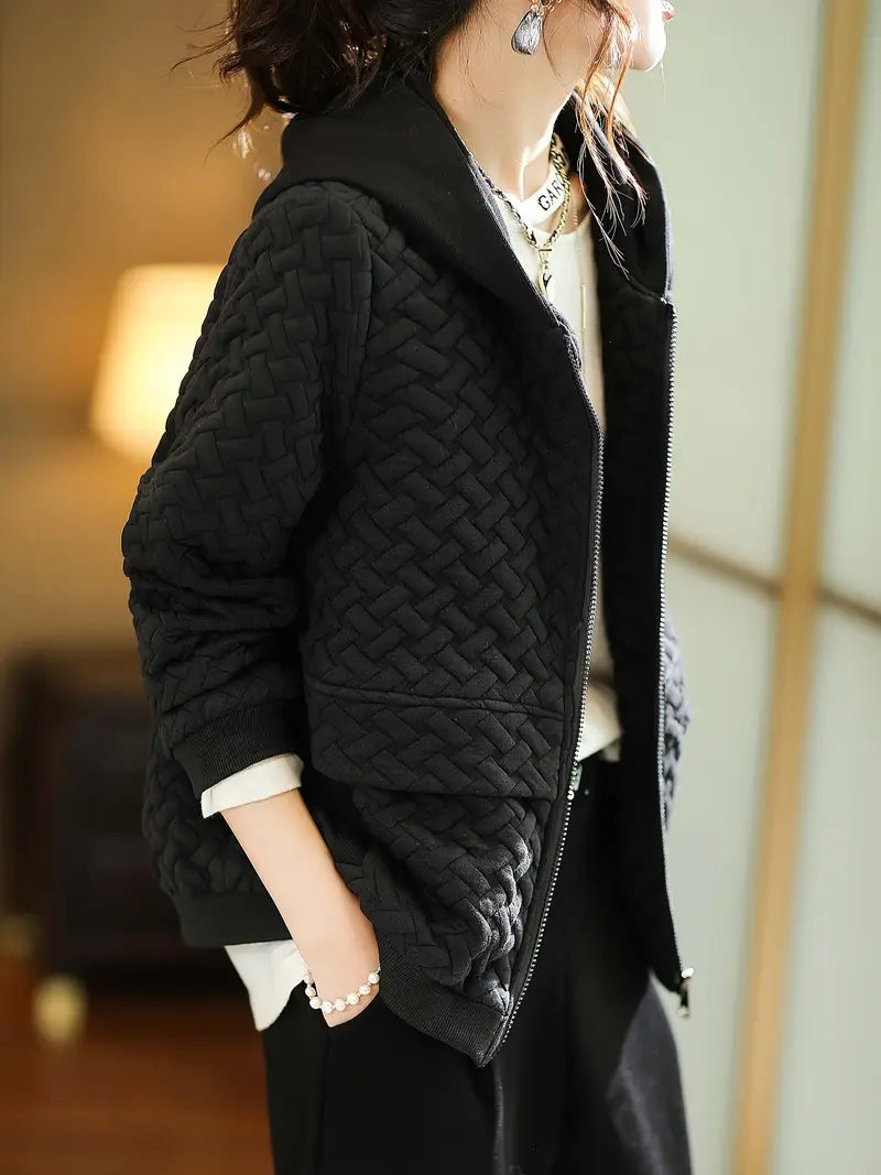 Quilted basketweave hoodie with zip pulled up to the collar, front view