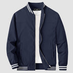 Lightweight bomber jacket windbreaker in sapphire blue with rib-knit collar and full metal zip.