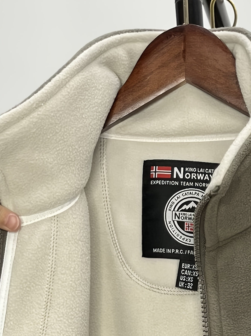 Fleece jacket high collar outdoor in navy, red, khaki, grey and black, collar and neckline detail.