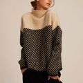 Chevron knit turtleneck sweater in brown with a relaxed fit and high collar, front view.
