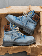 Blue washed denim boots with lace-up front and chunky sole, side view