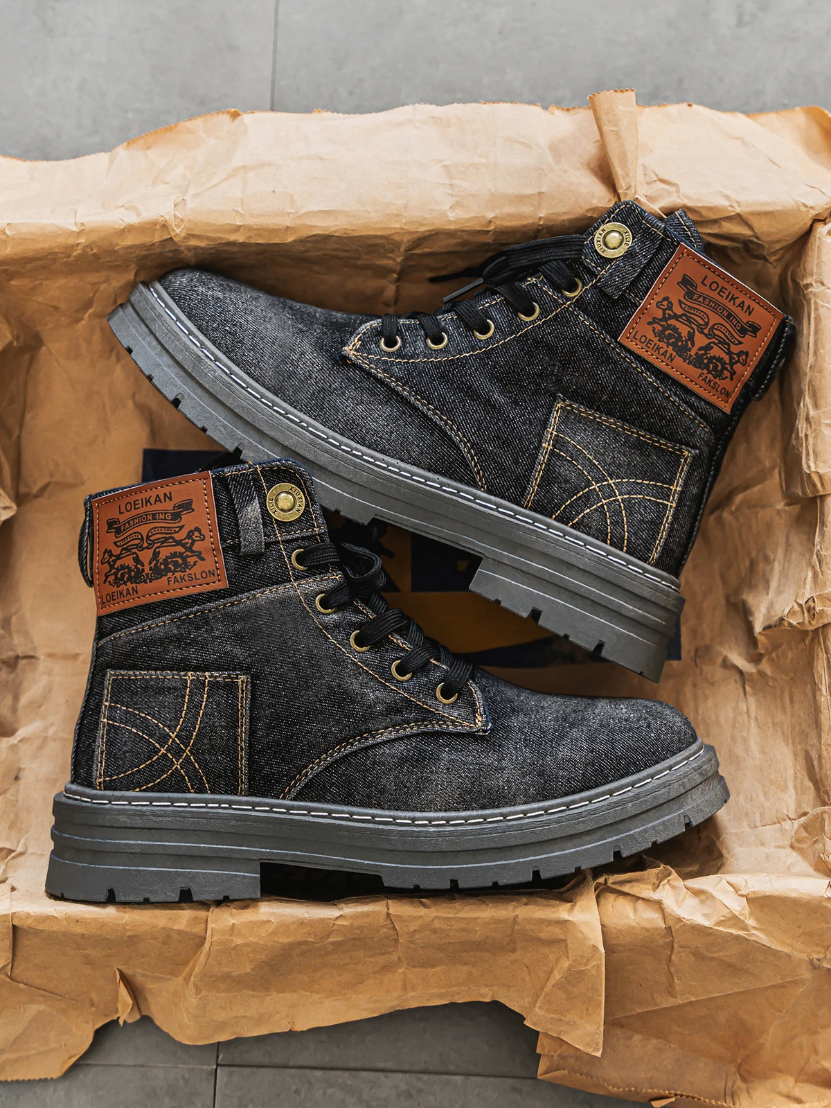 Black washed denim boots with lace-up front and chunky sole, side view