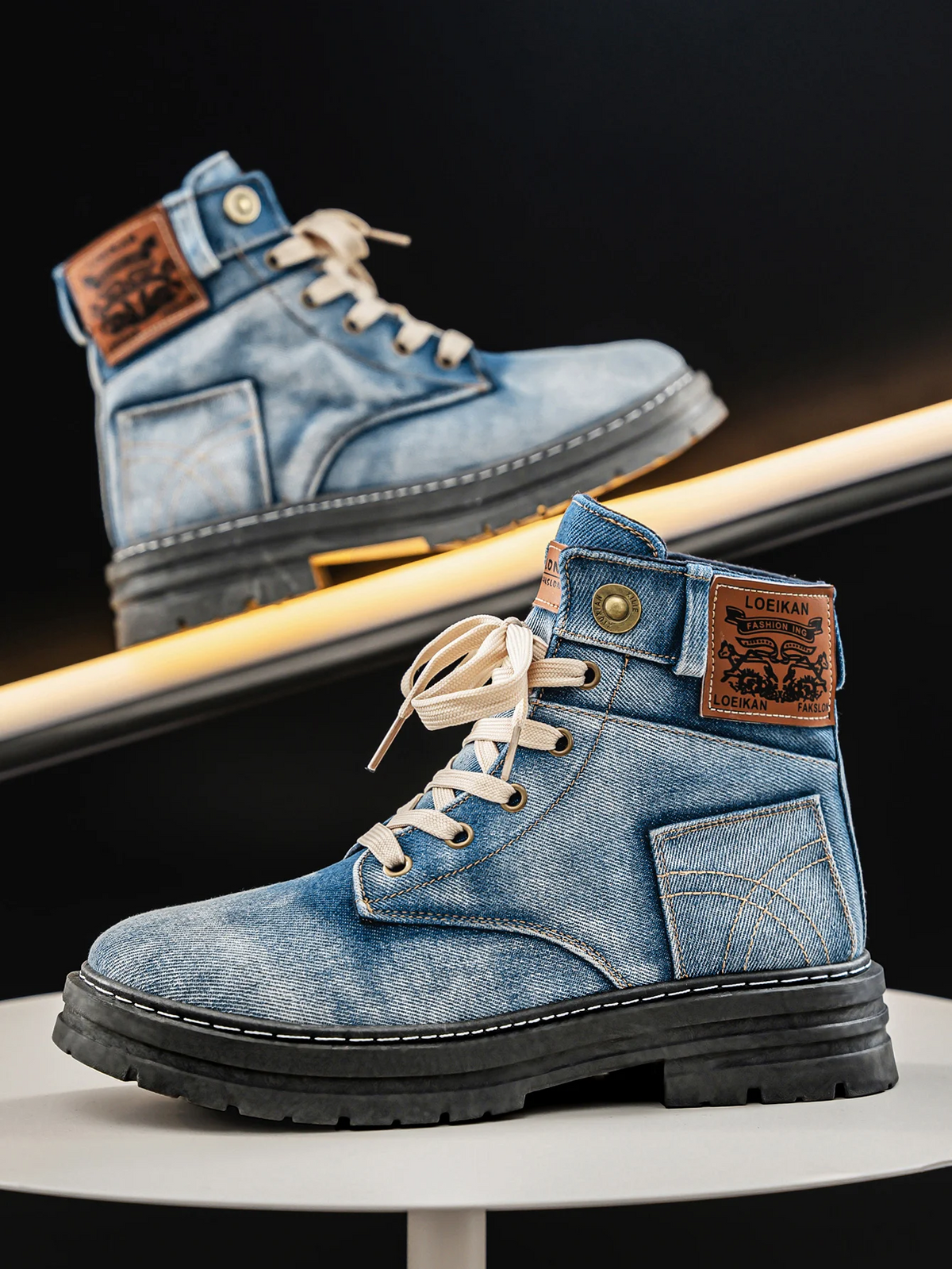Washed denim lace-up boots with chunky anti-slip rubber sole, angled view